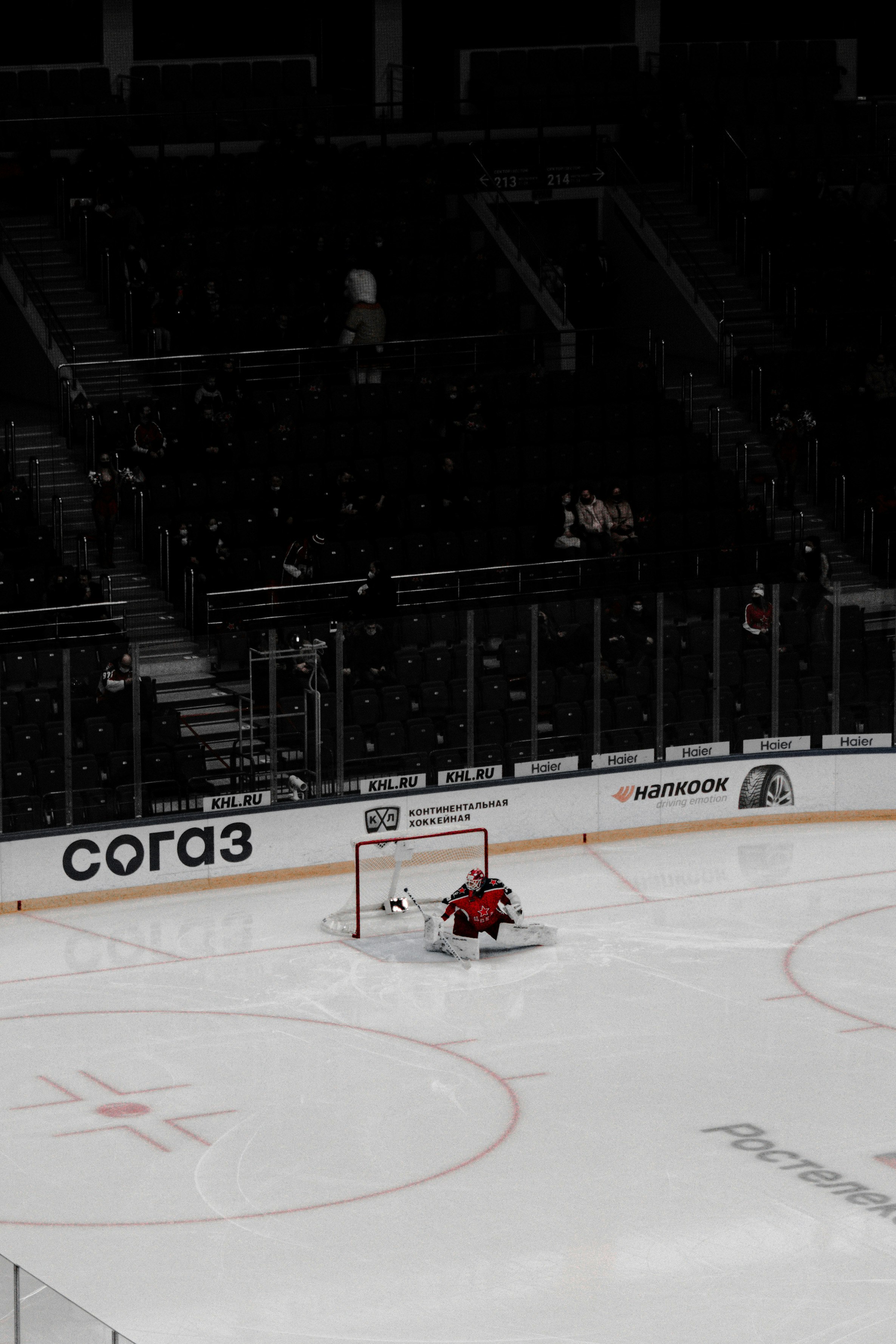 people riding red go kart on ice stadium